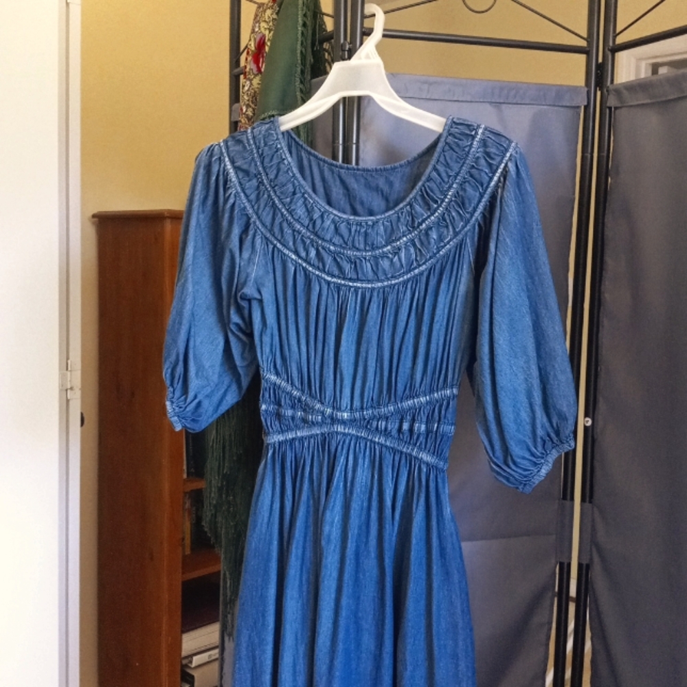 A beautiful, gently worn dark blue dress.